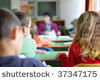 Stock-photo-kids-in-classroom-studying-photographed-from-behind-37347175.jpg